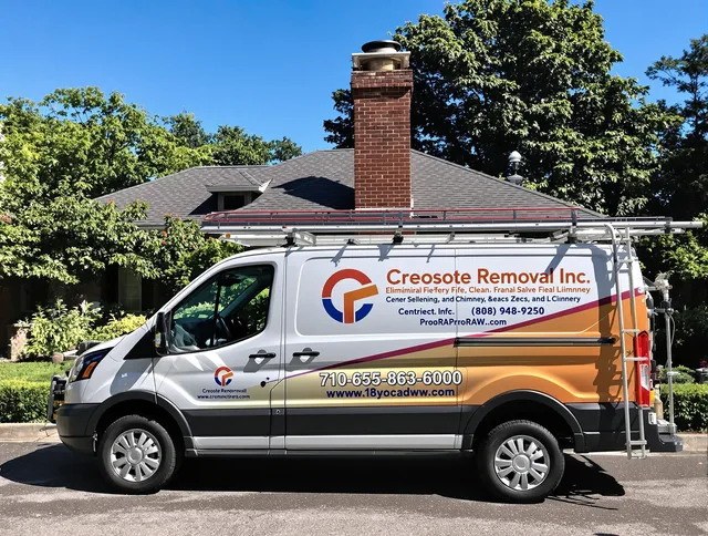 Huntersville Chimney Sweep technician removing creosote safely in Huntersville, NC