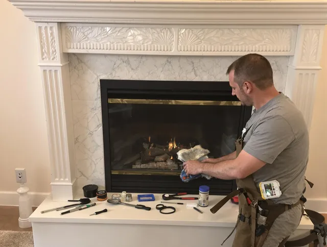 Huntersville Chimney Sweep performing fireplace maintenance in Huntersville, NC
